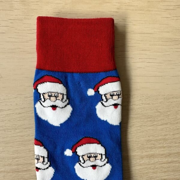 blue and red santa faced socks